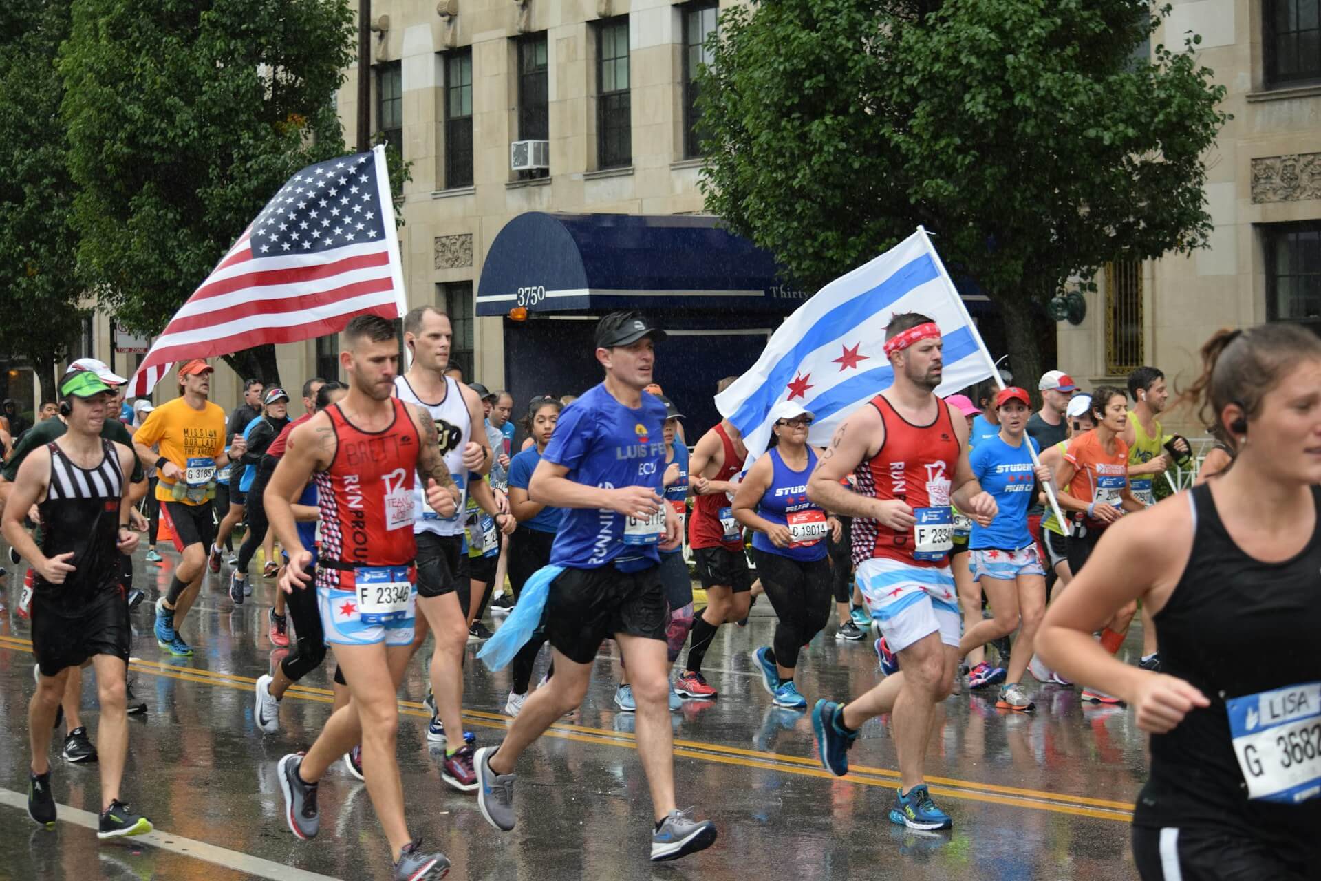 A marathon runner carrying the Chicago flag